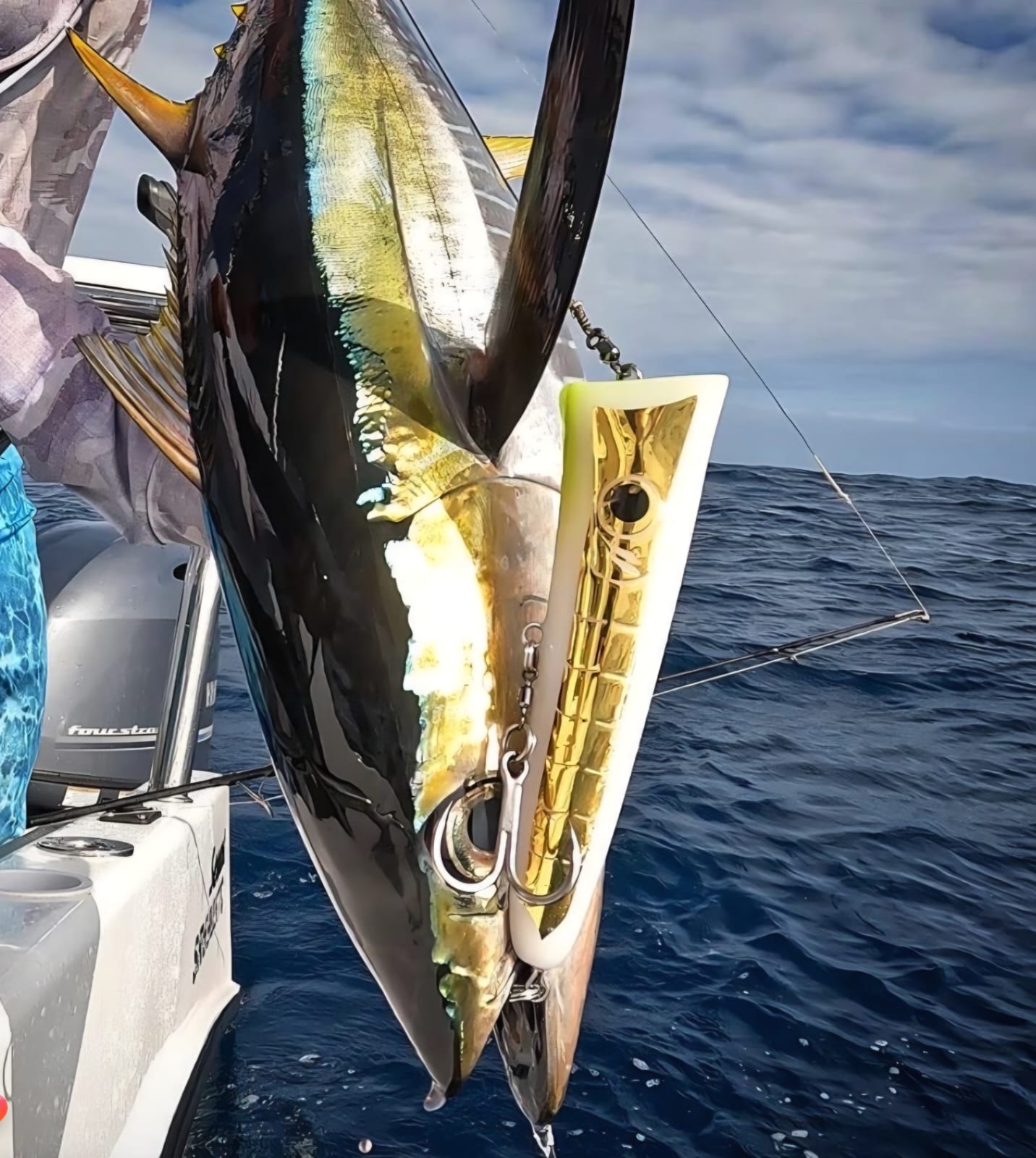 Mayday lure alongside a catch on the boat