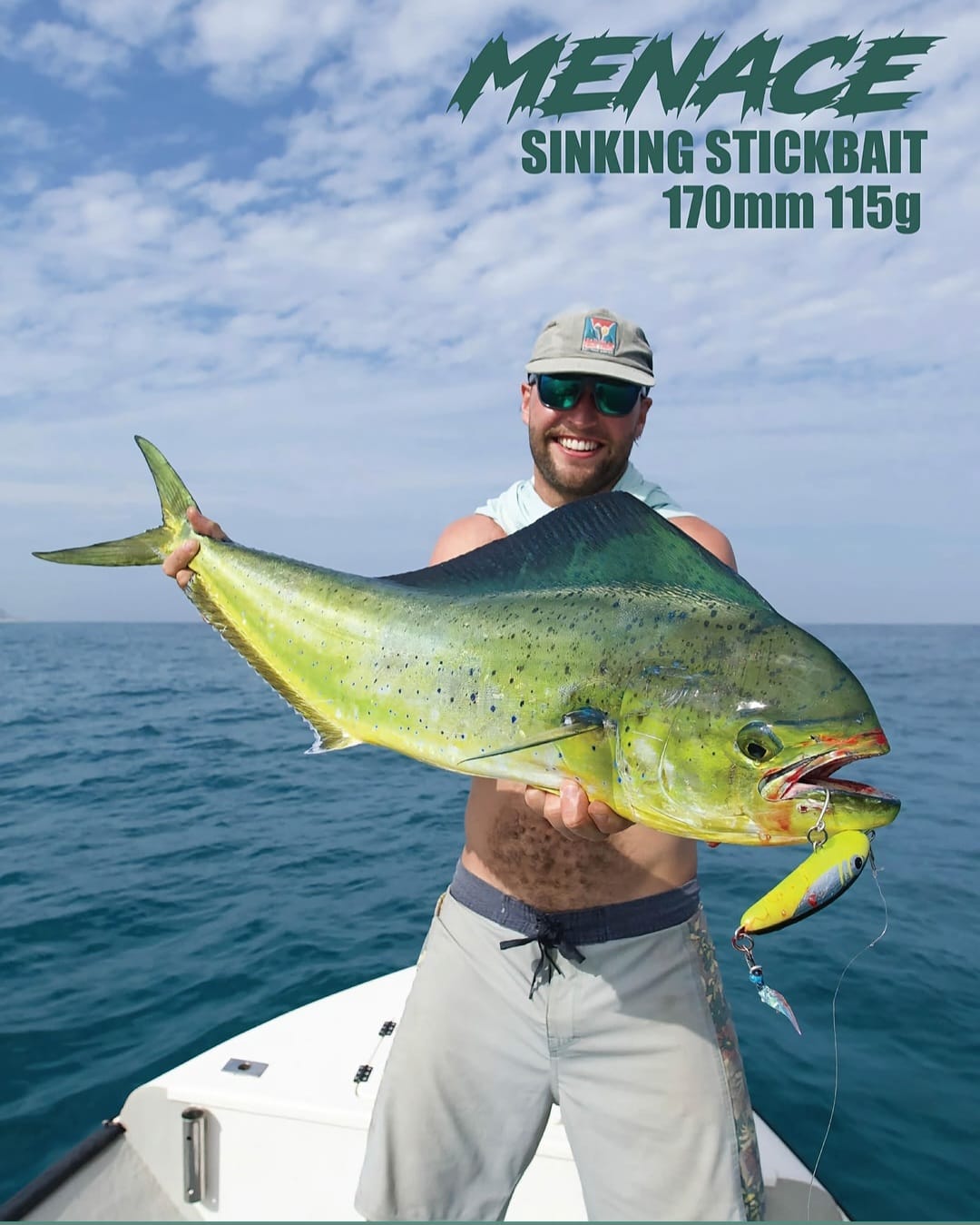 Angler holding a dorado with Mayday Menace stickbait branding